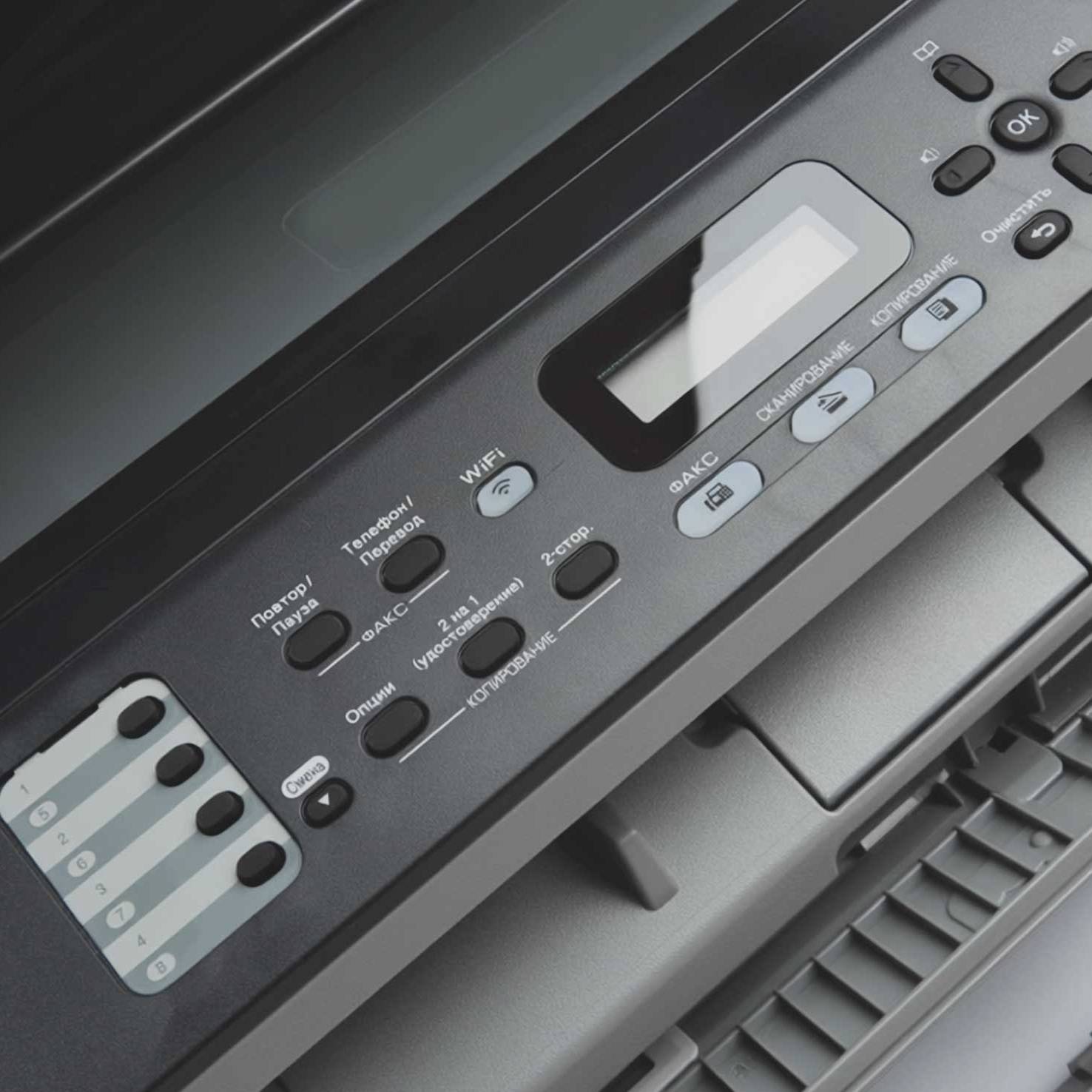 Close-up of a commercial printer control panel, highlighting Dragonfly Tech's secure, serverless cloud print solutions for UK hybrid workplaces.